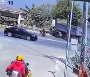 Dude Walking Sandwitched by Truck & Car.