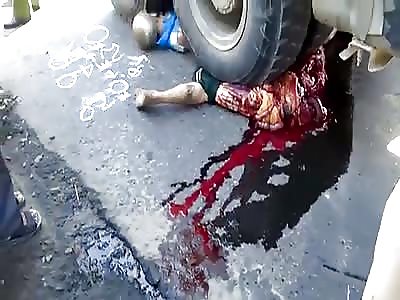 Motorcyclist busted by the tires of a truck