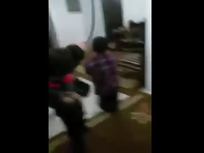 Father punishes his little son giving lashes in the feet