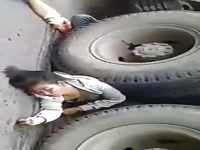 Woman crushed by a truck still moves