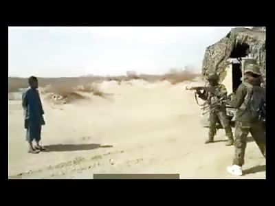 Soldiers from the Afghanistan army carrying machinegun execution of Pakistan Taliban member  