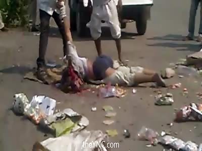 Lift The Body Of A Dead Man Run Over in a Pile of Garbage 