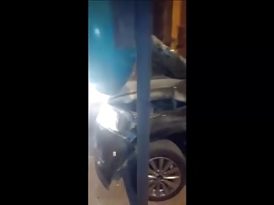 The Driver Crushed Between His Car And A Street Lighting Pole