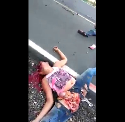 Woman with Legs Wide Open and Face Destroyed Lies Dead Beside Husband's Body