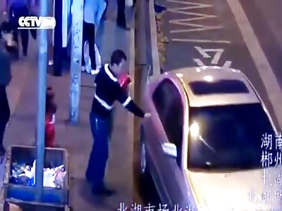 PASSERSBY RUSHED TO AID OF A WOMAN WHO WAS TRAPPED UNDERNEATH A CAR