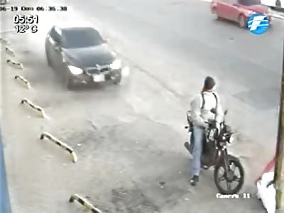 BIKER BRUTALLY HIT BY CAR