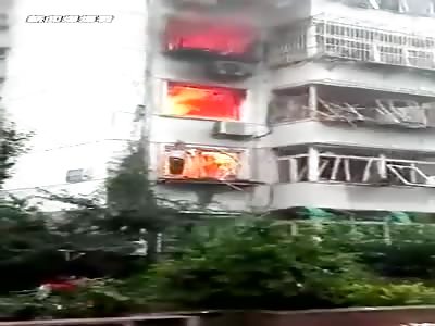 CHINESE WOMAN TRAPPED IN THE FLAMES