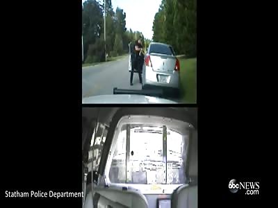 WOMAN DRAGS POLICE OFFICER WITH CAR