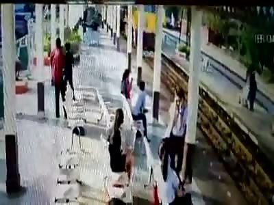 MAN COMMITS SUICIDE JUMPING IN FRONT OF TRAIN (ANOTHER ANGLE)
