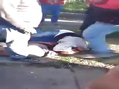 THIEF BEING BEATEN BY MOB