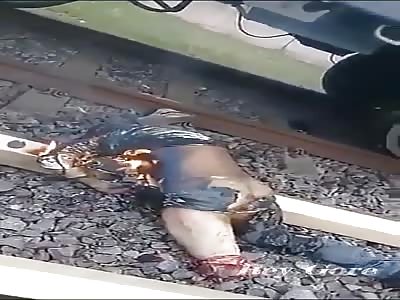 MUTILATED AND BURNED NEAR THE TRAIN TRACKS
