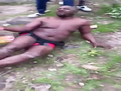 MAN BEING BEATEN BY MOB