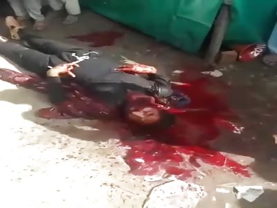 MAN IN A POOL OF BLOOD