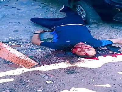 MURDERED MAN LYING ON THE GROUND