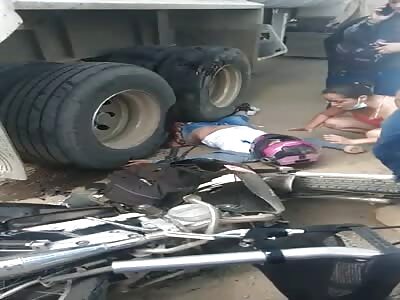 UNDER THE TRUCK WHEELS 