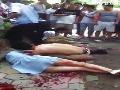 Woman sliced in throat by robber with Knife.