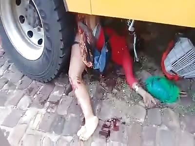 Biker Hemmed Up underneath Bus is a Gory Scene to Watch 