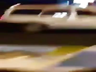 Guy listening to floor is shot.