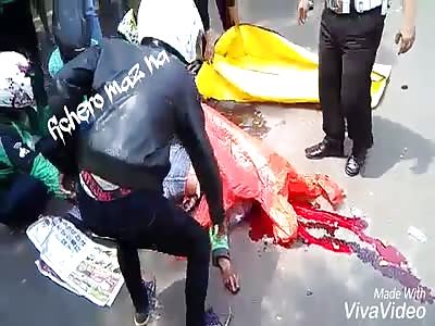 Picking up a corpse of a man run over