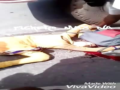 Woman on crushed motorcycle