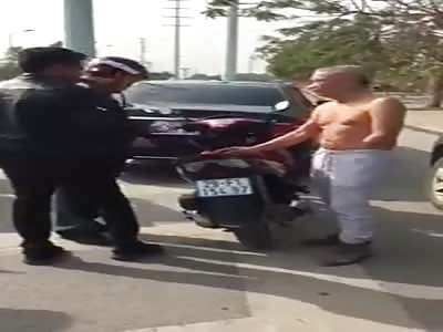 MAN WITH A HAND HITS MOTORCYCLIST