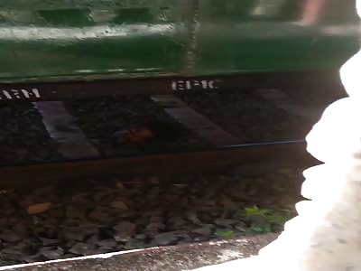 HEADLESS MAN UNDER THE TRAIN