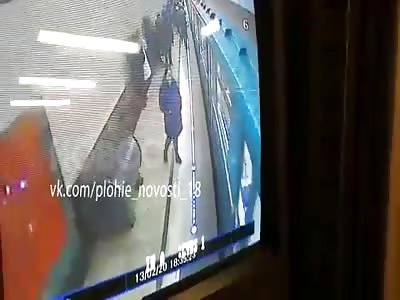 Russia: Man Leaps Under Incoming Train