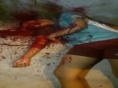 Body of murdered man lying in the street.