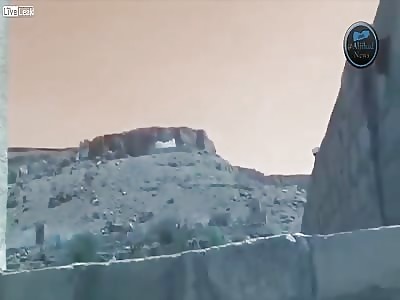 A Yemenist cameraman finds himself uncomfortably close to a Houthi arms cache as its bombed by the Saudi air force 