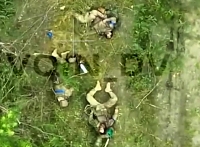 Destroyed UA vehicle and bodies of UA soldiers after RU strike