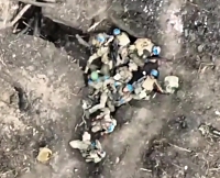 A full trench with living, wounded and probably dead UA soldiers