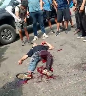 Young man laying dead after knife fight 