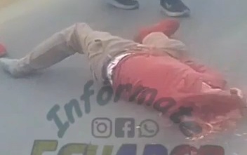 Horrific truck accident victim with his skull cracked on the asphalt 