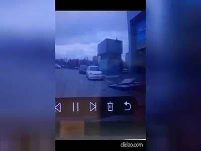 Woman crushed by massive sign that falls off a building