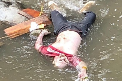 Drowned dead corps floating in river