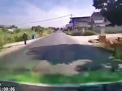 Man doesn't look both ways and gets hit by a car. China, 25 December