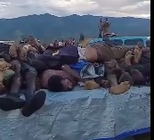 Bodies Piled up like Food at a Cookout Following Tribal Massacre