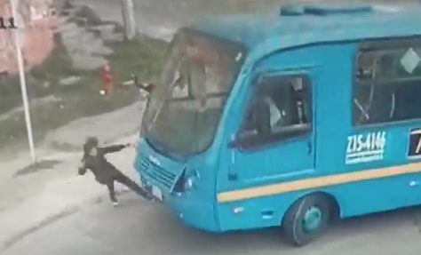 Old woman crossing street crashed by bus