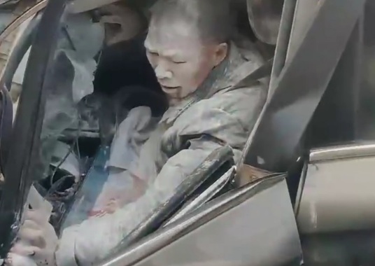 Driver trapped inside his smashed car after collision with truck 