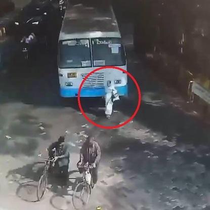 Distracted Lady Meets The Bus In India