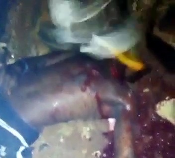 BLACK AXE GANG MEMBER BEHEADING RIVAL HEAD WITH AXE