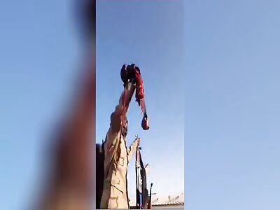 Yanjawid terrorists show off the organs of their victim in Sudan