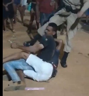 man is brutally kicked by a police officer