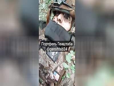 Russians film dead Ukrainian 