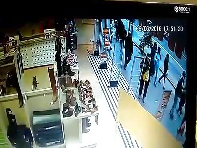 21 year Old Man Shot in the Head While Walking with His Mother in Busy Street