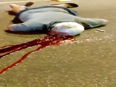 Man Lying Dead on the Street after Getting Shot in the Head