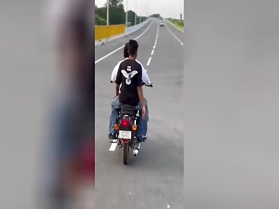 Two guys on bike wrecked into