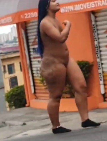 Naked Woman On The Avenue