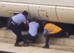 Removing crashed body from under train 
