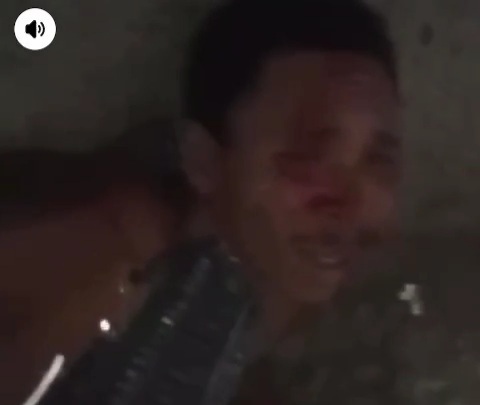 Brazilian gang member showing wounded and killed rivals 